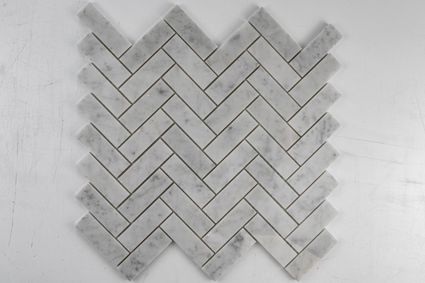1"x3" Carrara Herringbone Polished