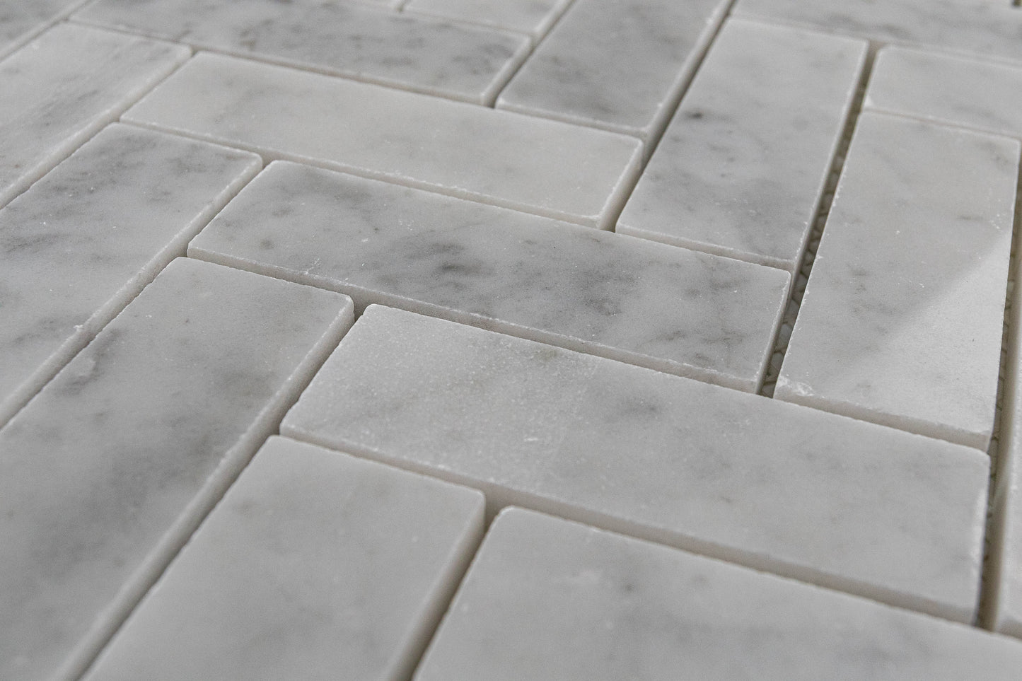 1"x3" Carrara Herringbone Polished