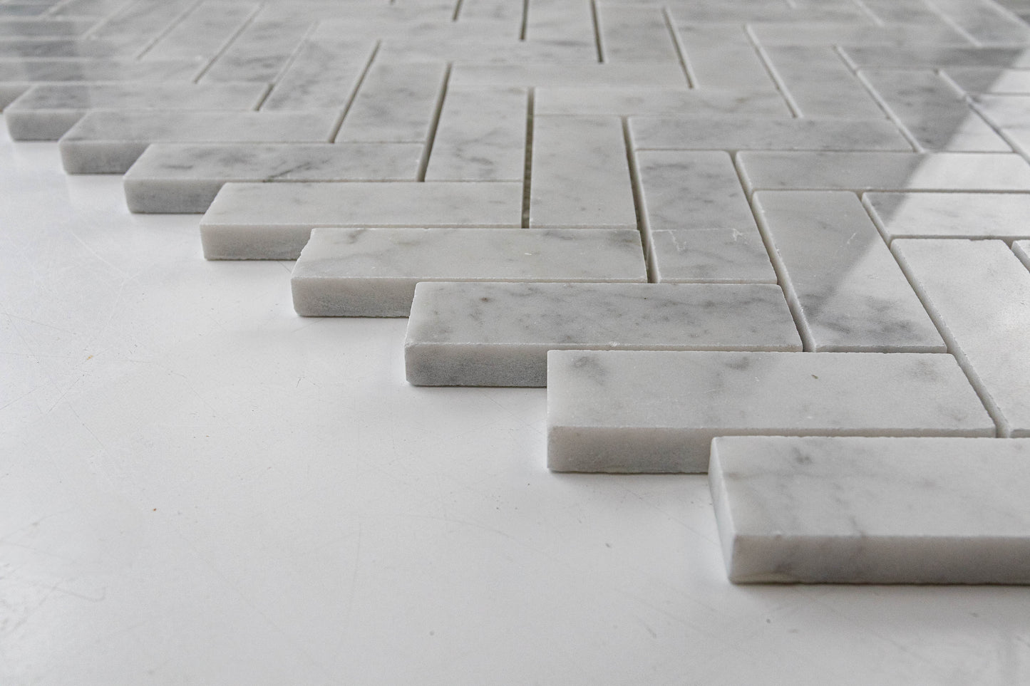 1"x3" Carrara Herringbone Polished